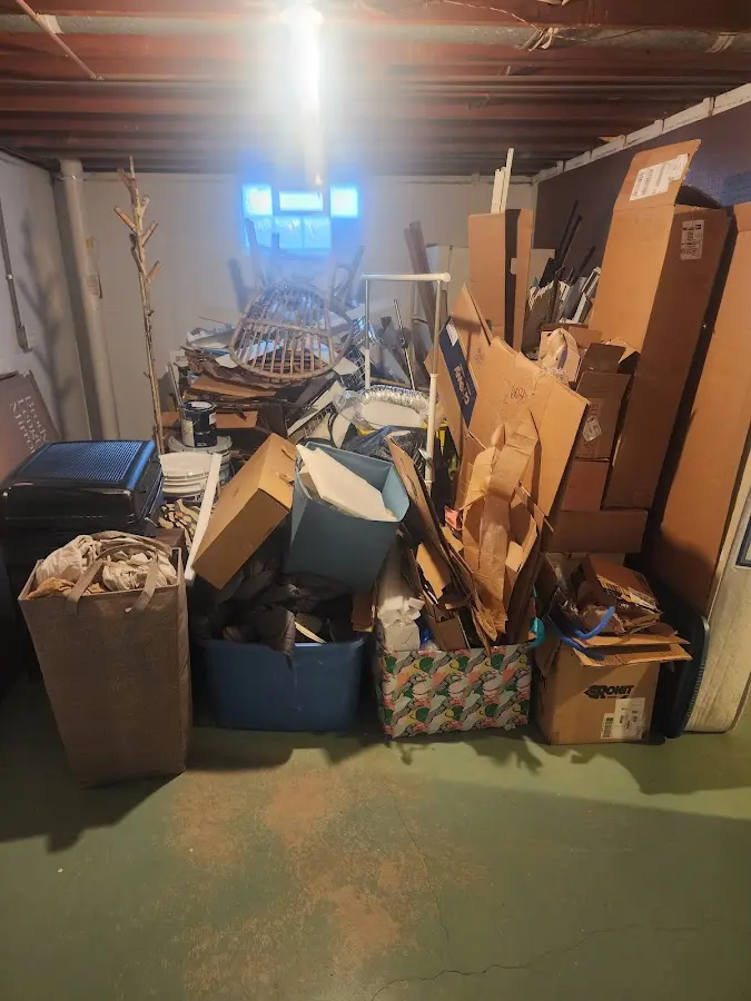 Roll-off dumpster container at job site for 15 Yard Dumpster Rental in Delhi